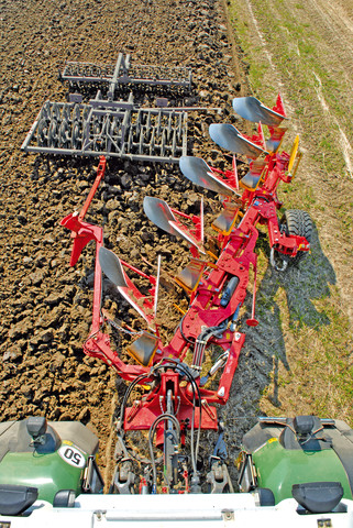 Furrow press on the plough