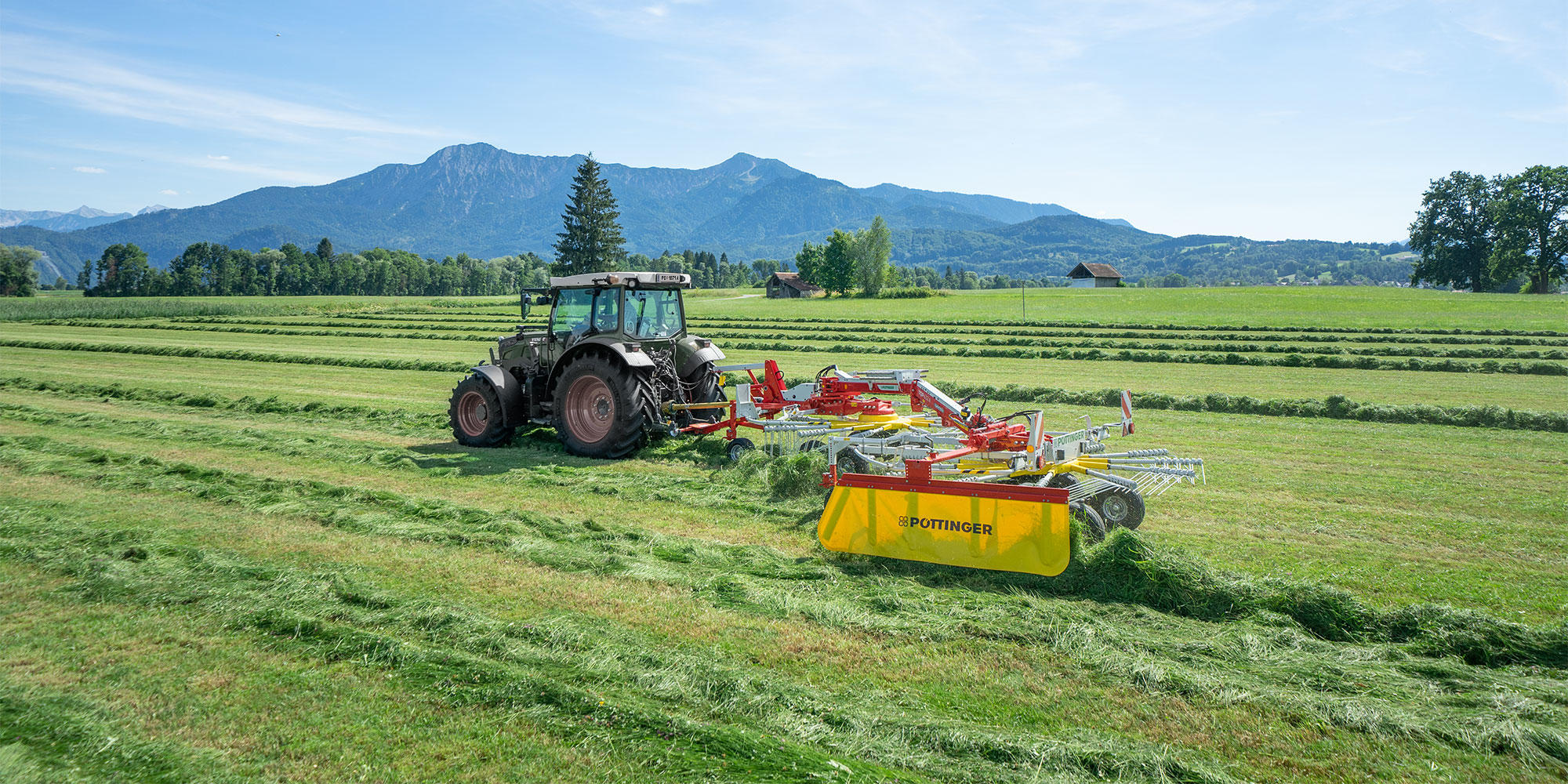 Twin rotor rakes with side swath placement without transport